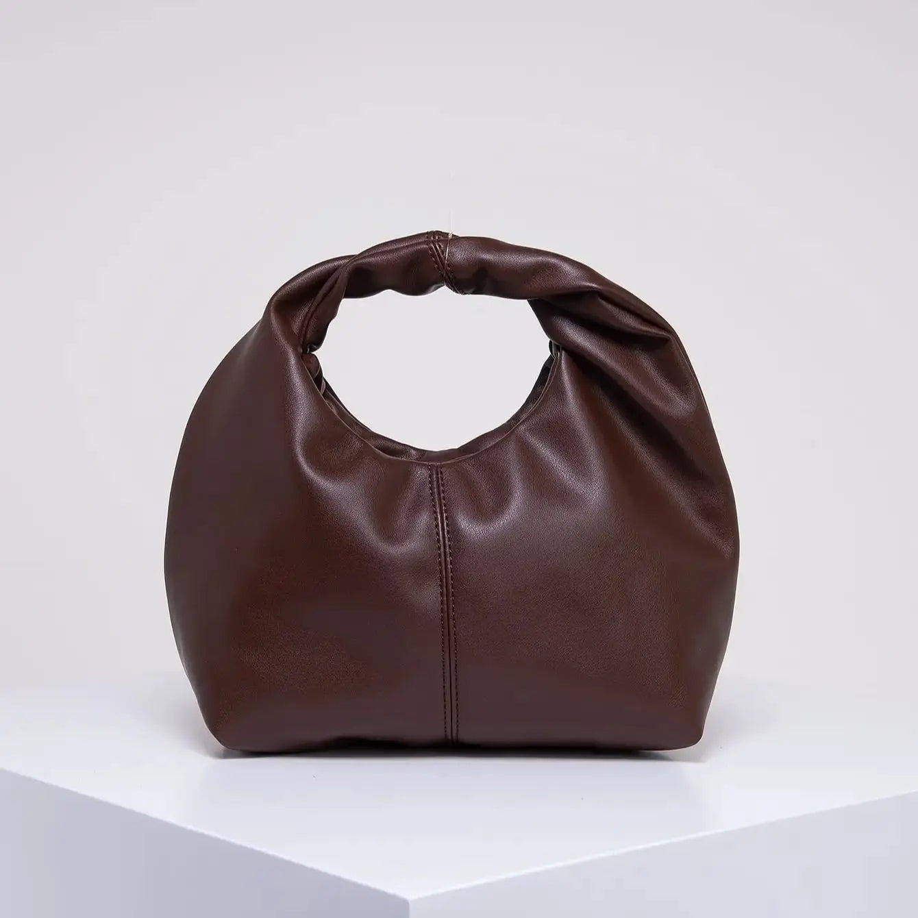 Stylish twist top handle pouch bag